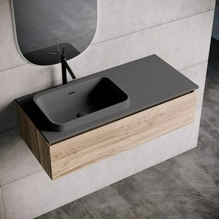 Lavabo y encimera Paul izquierda - 46 x 101 cm, Orificios para grifo: Izquierda, Con desbordamiento, Antracita - Un lavabo de baño moderno con una superficie gris y un tocador con aspecto de madera debajo de un espejo.