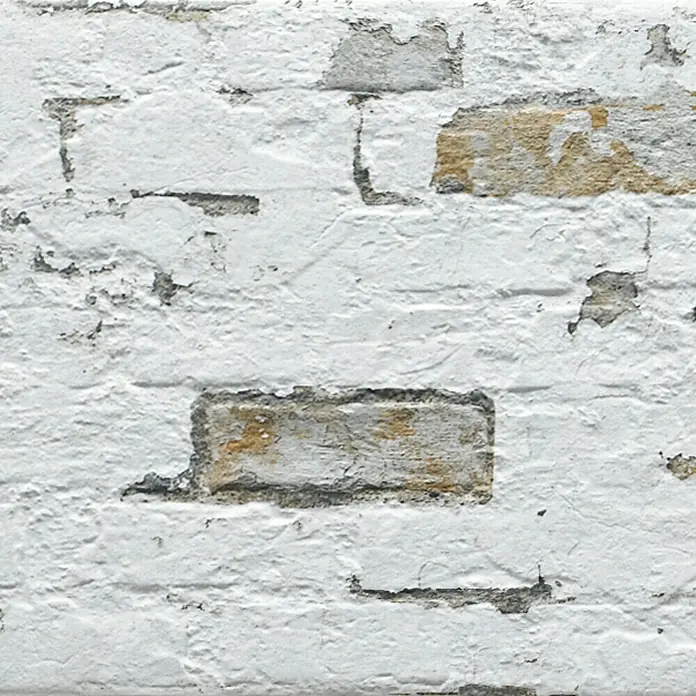 Verblendstein Pompeya Jet - 66,6 x 33,3 cm, Weiß, Steinoptik - Weiße Ziegelwand mit abblätternder Farbe, die eine rustikale und Vintage-Atmosphäre erzeugt. Perfekt für Hintergründe.
