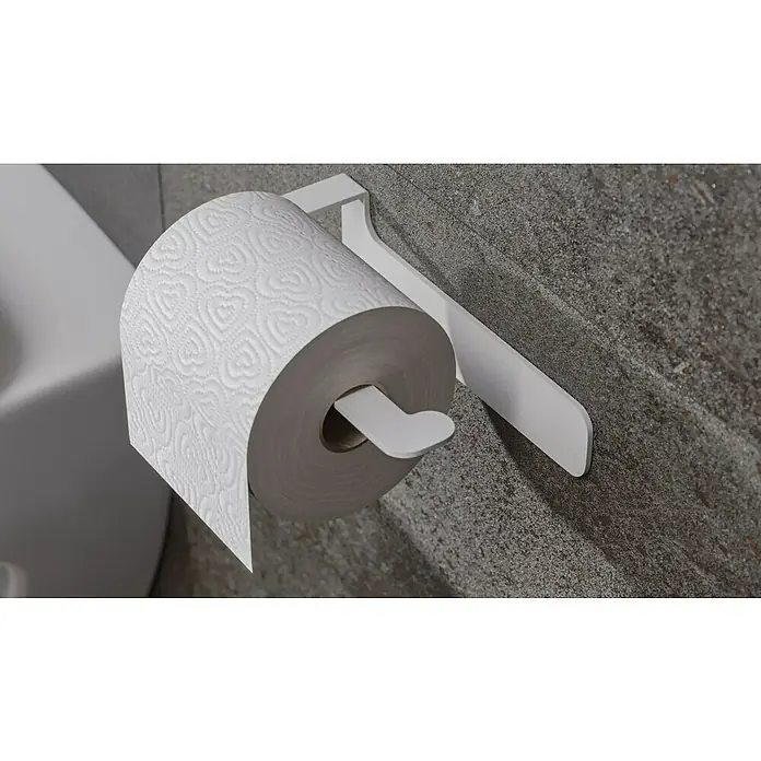 Camargue Antwerpen Papierrollenhalter - 16,5 x 9 x 5,5 cm, Weiß, Matt - Nahaufnahme einer Toilettenpapierrolle mit Herzmuster auf einem weißen Halter an einer grauen Wand im Badezimmer.
