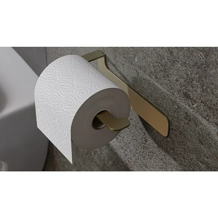 Camargue Antwerpen Papierrollenhalter - 16,5 x 9 x 5,5 cm, Gold, Matt - Eine Nahaufnahme einer Toilettenpapierrolle mit Herzmuster auf einem goldenen Halter an einer grauen Wand.