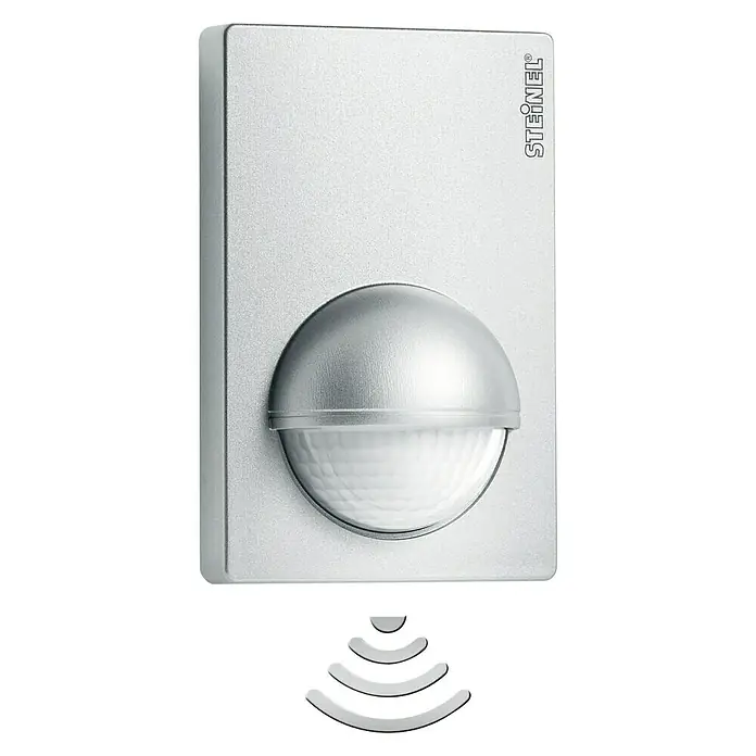 Steinel Bewegungsmelder IS 180-2 silber - Reichweite Sensor: 12 m, Inox-Look, Erfassungswinkel Sensor: 180 °, L x B x H: 56 x 76 x 120 mm - Nahaufnahme eines Steinel-Bewegungsmelders in Silber mit Wellensymbol, ideal für die automatische Lichtsteuerung im Außenbereich.