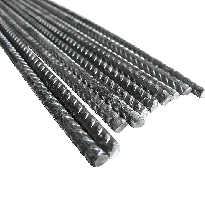 BHS Valencia Varilla corrugada - Ø x L: 12 mm x 3 m, Acero - Un haz de barras de refuerzo corrugadas apiladas, listas para su uso en la construcción. La superficie es rugosa y proporciona un buen agarre en el hormigón.