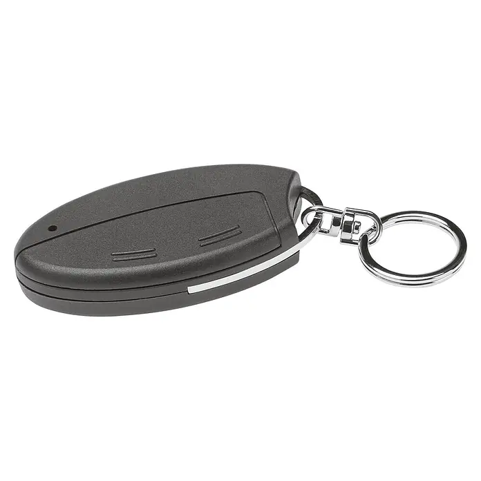 Homematic IP Funkfernbedienung Schlüsselanhänger Alarm HmIP-KRCA - Schwarz, 14 x 38 x 75 mm - Nahaufnahme eines schwarzen Autoschlüssels mit einem silbernen Schlüsselanhänger auf schwarzem Hintergrund.