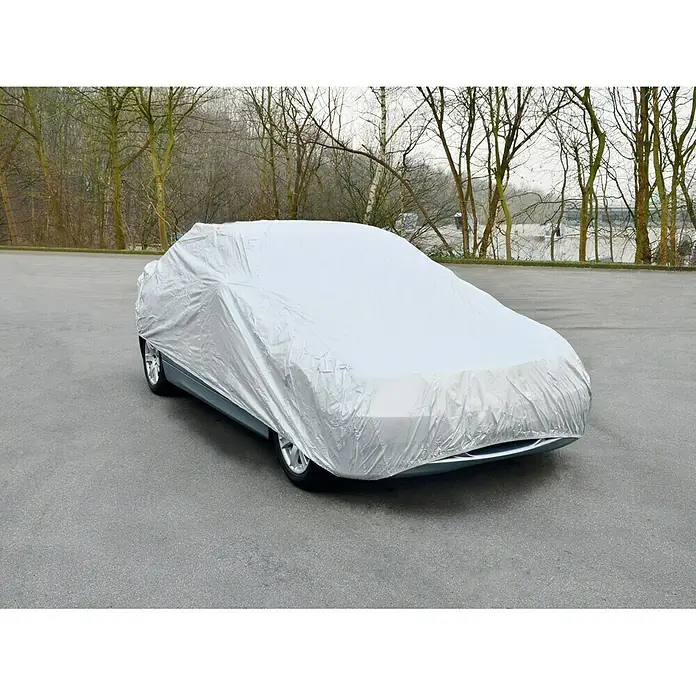 APA Auto-Vollgarage - L x B x H: 500 x 200 x 120 cm, Farbe: Silber - Ein Auto mit einer silbernen Autoabdeckung, die das Fahrzeug vor Witterungseinflüssen schützt, steht im Freien.