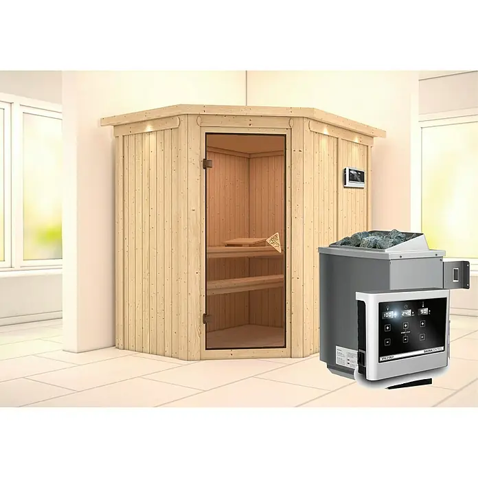Karibu Elementsauna Carin - Mit 9 kW Ofen mit externer Steuerung, Mit Dachkranz und Beleuchtung, L x B x H: 165 x 210 x 192 cm - Produktansicht einer Ecksauna mit Holzverkleidung und einem Saunaofen mit Steinen.