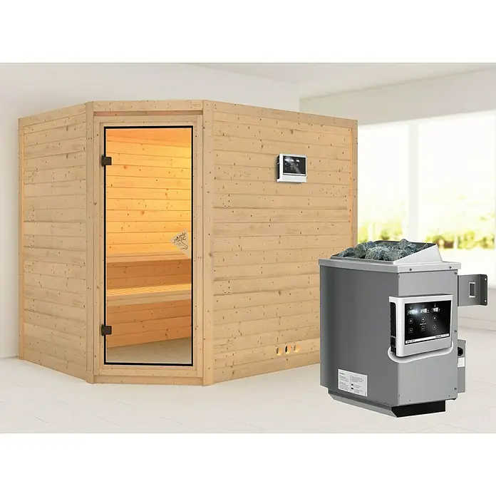 Karibu Massivholzsauna Tanami - Mit 9 kW Ofen mit externer Steuerung, Ohne Dachkranz, L x B x H: 231 x 196 x 192 cm - Bild einer Sauna mit einem Holzofen und einer Glastür. Die Sauna hat auch eine digitale Steuerung und Steine auf dem Ofen.