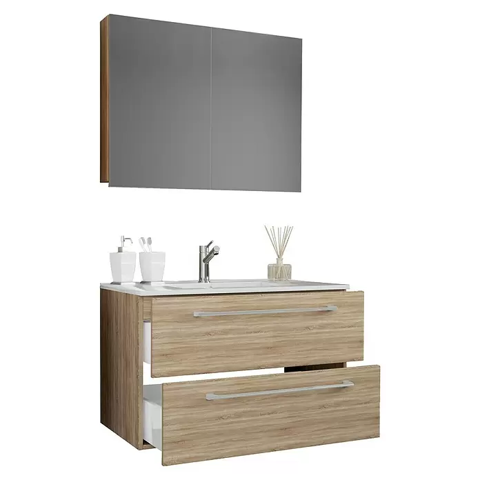 VCM Badinos Badmöbel-Set SPS - 60 cm, Sonoma-Eiche, 3 -tlg. - Moderner Badezimmerschrank aus hellem Holz mit weißem Waschbecken, Chromarmatur und grauem Spiegelschrank. Schublade leicht geöffnet.