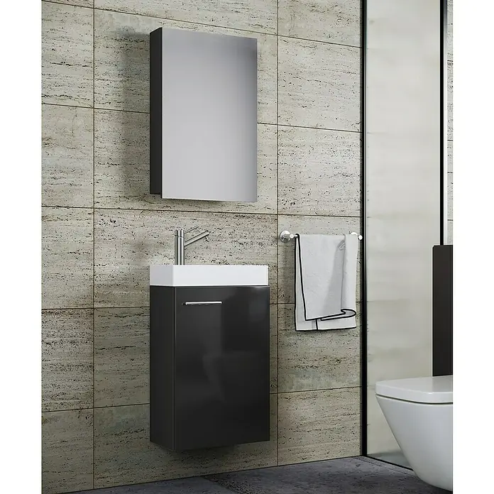 VCM Badmöbel-Set SPS - Gesamtbreite Badmöbel: 41 cm, Schwarz, Glänzend, 3 -tlg. - Ein modernes Badezimmer-Ensemble mit Waschtischunterschrank, Waschbecken und Spiegelschrank vor einer strukturierten Wand.