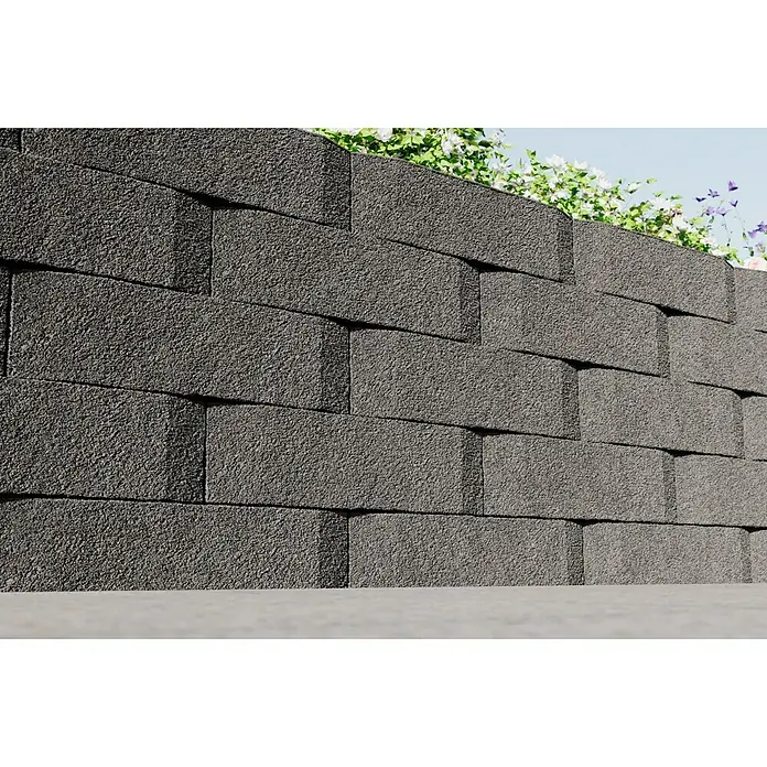 Christoph Mauerstein Antikblock - 30 x 15 x 7,5 cm, Grau, Beton - Nahaufnahme einer Mauer aus grauen Betonsteinen mit rauer Oberfläche, die als Gartenmauer oder dekoratives Element dient.
