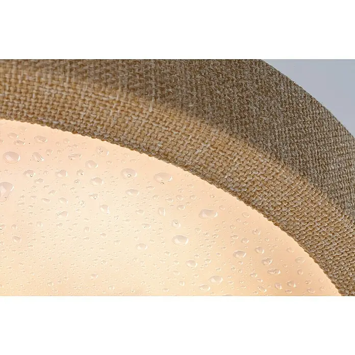 Paulmann LED-Panel rund Cosara - 15 W, Ø x H: 30 x 6,2 cm, Beige, Warmweiß - Nahaufnahme einer runden Lampe mit Stoffschirm, der mit Wassertropfen bedeckt ist und eine warme Lichtquelle hat.