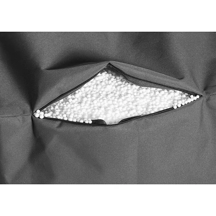 Sitting Point Sitzsack Twist Scuba90 x 70 x 80 cm, Anthrazit, 100 % Polyester/100 % Polyvinylchlorid - Nahaufnahme einer grauen Sitzsackhülle, teilweise geöffnet mit Füllmaterial aus weißen Styroporkugeln.