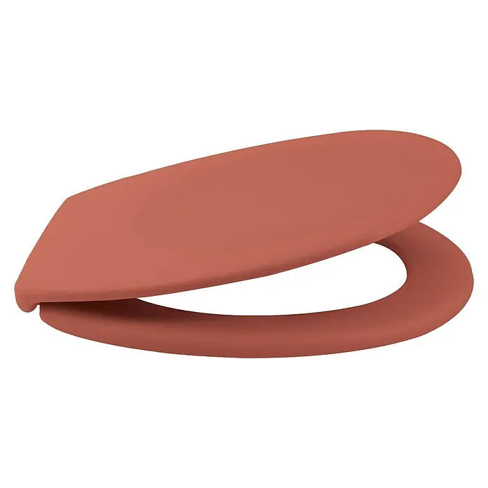 Spirella Tapa de WC Neela - Duroplast, Terracota, Con caída amortiguada - Un primer plano que muestra un asiento de inodoro color coral, destacando un diseño minimalista y moderno para un baño.