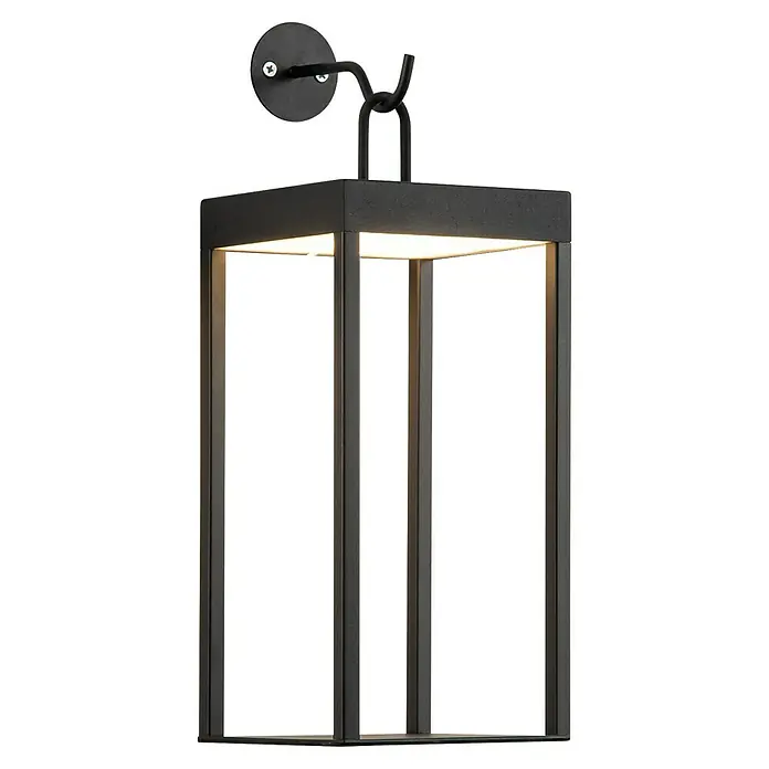 Tween Light Akku-Wandleuchte Bellagio - 35 x 13,2 x 15 cm, Schwarz, Warmweiß, 3 W, IP44 - Nahaufnahme einer modernen schwarzen Außenwandleuchte mit einem quadratischen Lampenschirm, der helles Licht ausstrahlt.