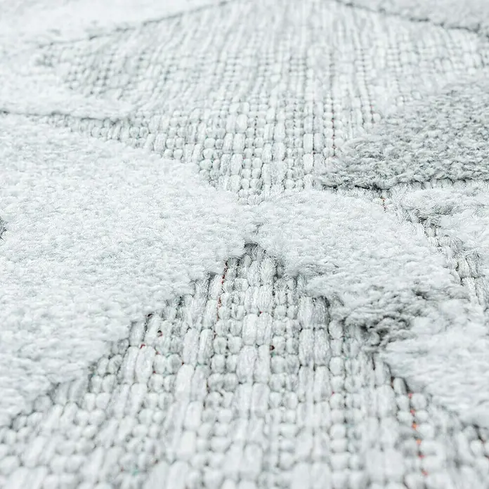 Outdoor-Teppich Bahama VII - Grau, 200 x 140 cm, 100 % Polypropylen - Nahaufnahme eines strukturierten Teppichs mit weißen und grauen Mustern, der eine weiche und taktile Oberfläche zeigt.