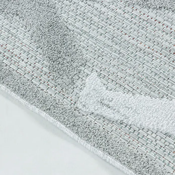 Outdoor-Teppich Bahama VII - Grau, 200 x 140 cm, 100 % Polypropylen - Detailaufnahme eines grauen Teppichs mit geometrischen Mustern und einem weichen, strukturierten Finish für Wohnräume.