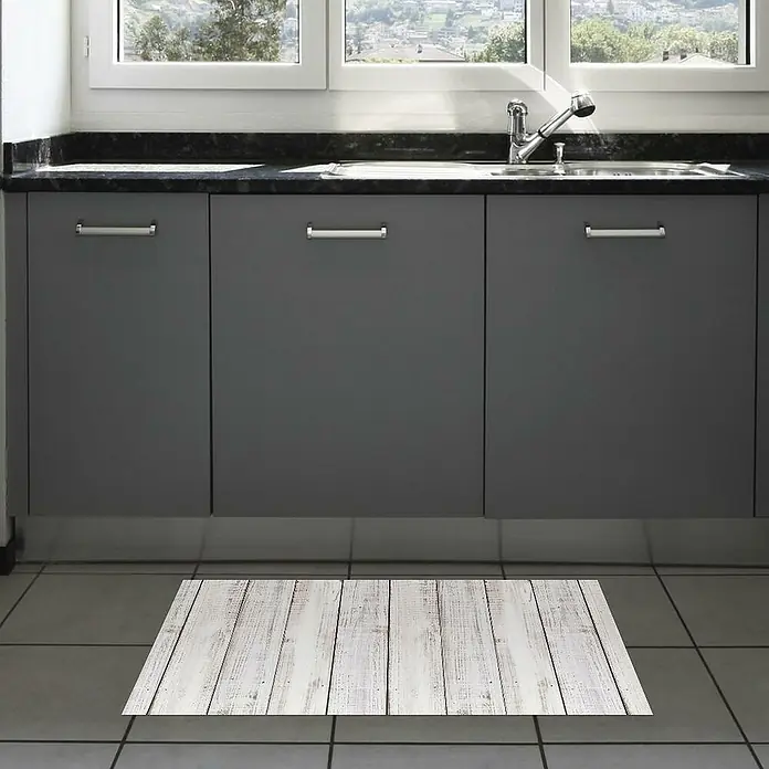 Alfombra de vinilo Croma Madera - Blanco, 110 x 50 cm, PVC - Una alfombra de cocina rectangular, encalada con un sutil patrón de tablones de madera, que realza el área de la cocina.