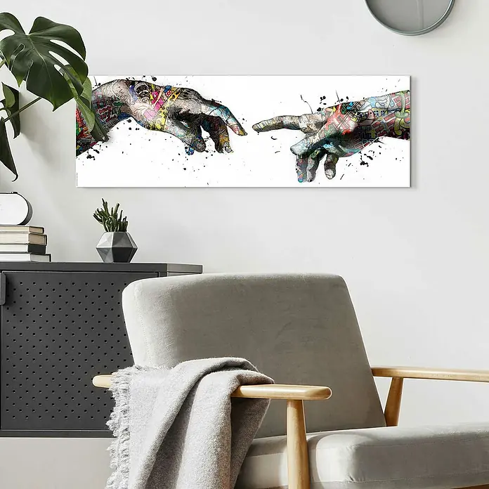 Reinders Decopanel - Creation Art, B x H: 90 x 30 cm - Kunstvoller Leinwanddruck "Die Erschaffung Adams" mit lebendigen Graffiti-Elementen, eine moderne Interpretation eines Klassikers, aufgehängt im Wohnzimmer.