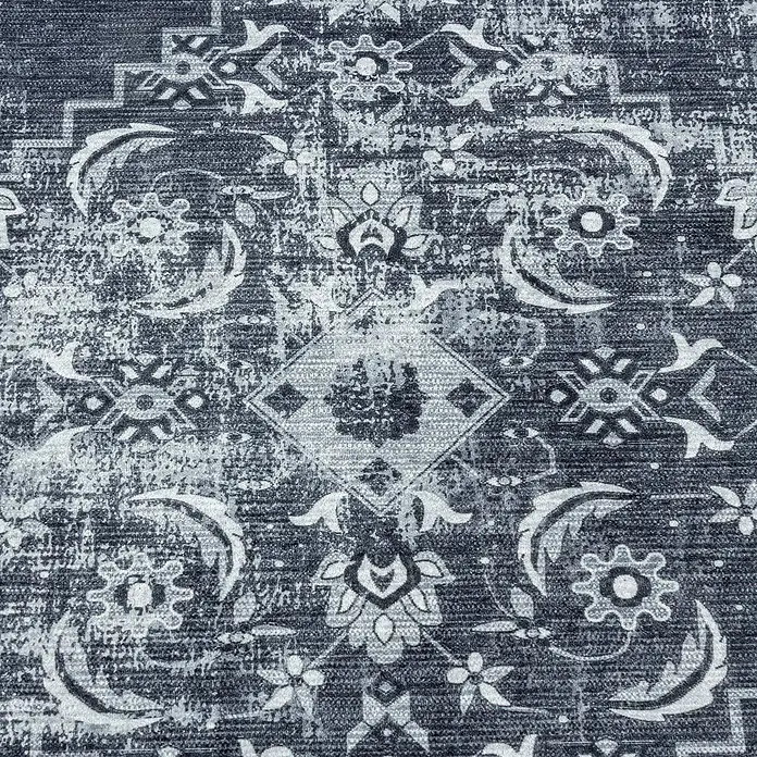 Flachgewebeteppich Fiesta - Schwarz/Grau, 290 x 200 cm, 100 % Polyester - Nahaufnahme eines dunkelgrauen Teppichs mit stilisiertem floralem Muster in Grau- und Weißtönen, der eine elegante und moderne Note vermittelt.