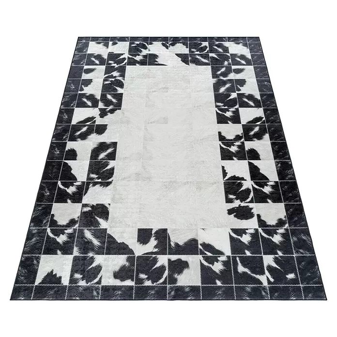 Flachgewebeteppich Fiesta - Schwarz/Weiß, 290 x 200 cm, 100 % Polyester - Rechteckiger Patchwork-Teppich aus Kuhfell in Schwarz-Weiß mit weißer Mitte und gemustertem Rand.