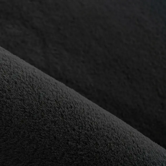 Hochflorteppich Pouffy - Schwarz, 150 x 80 cm, 100 % Polyester - Detailaufnahme eines luxuriösen, anthrazitfarbenen Kuschelfells, das Wärme und Komfort ausstrahlt. Ideal für Wohnaccessoires und stilvolle Dekorationen.