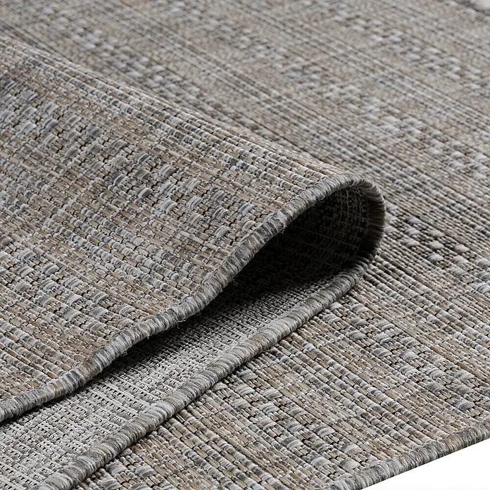 Outdoor-Teppich Zagora III - Beige, 170 x 120 cm, 100 % Polypropylen - Nahaufnahme eines gewebten Teppichs mit gerolltem Rand, der die Textur und das Muster betont.