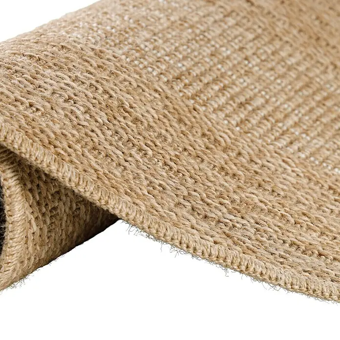 Outdoor-Teppich Comilla I - Beige, Durchmesser: 80 cm, 100 % Polypropylen - Nahaufnahme eines Teppichs aus Naturfasern mit detaillierter Textur und gewebter Kante, ideal für rustikale oder natürliche Inneneinrichtungen.