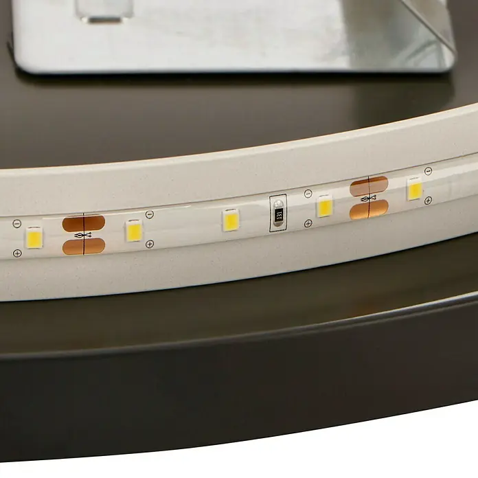 DSK Lichtspiegel Desire - Durchmesser: 55 cm, Schwarz, Leuchtmittel - Nahaufnahme eines LED-Streifens mit elektronischen Komponenten auf einem runden, modernen Möbelstück.