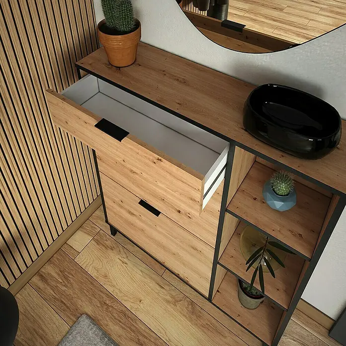 Meka Block Zapatero K-305 - L x An x Al: 24,5 x 90 x 111 cm, Roble Albar/Pizarra, Número de compartimentos: 2 ud. - Un mueble de lavabo de madera con detalles en negro, un cajón abierto y elementos decorativos como cactus y plantas.