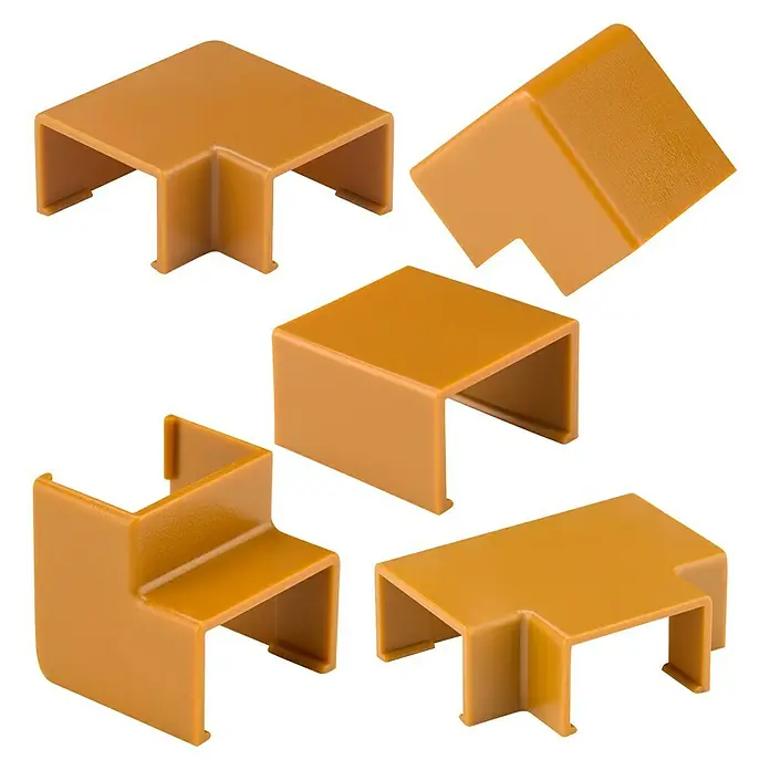 Inofix Plasfix Kit de accesorios para canaleta - Cerezo, An x Al: 1,6 x 1 cm, 7 ud. - Un primer plano de accesorios de canalización de cables de plástico de diversas formas y perspectivas, dispuestos sobre un fondo blanco.