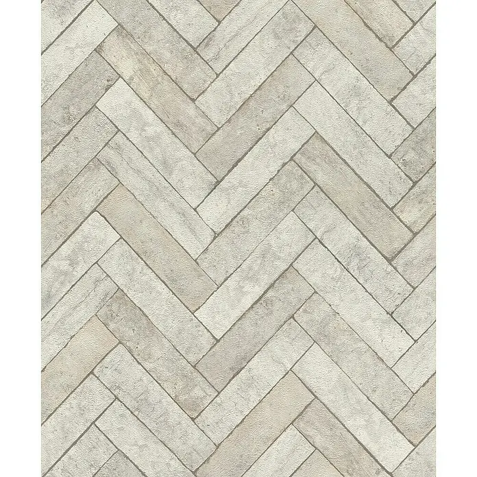 Rasch Factory V Vliestapete Bricks - Schiefergrau, Steinoptik, 10,05 x 0,53 m - Das Bild zeigt ein elegantes Fischgrätenmuster aus beigen und grauen Ziegeln, ideal für moderne Innenräume.