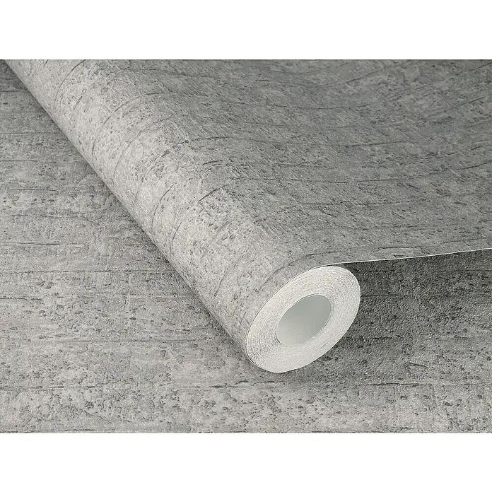 Rasch Factory V Vliestapete Betonoptik-Uni - Betongrau, Steinoptik, 10,05 x 0,53 m - Nahaufnahme einer Rolle grauer Tapete mit Ziegelmuster, die eine moderne und industrielle Atmosphäre für jeden Raum schafft.