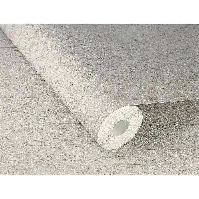 Rasch Factory V Vliestapete Betonoptik-Uni - Greige, Steinoptik, 10,05 x 0,53 m - Nahaufnahme einer Rolle grauer Betontapete, die eine realistische Betonstruktur mit feinen Details und Texturen zeigt.