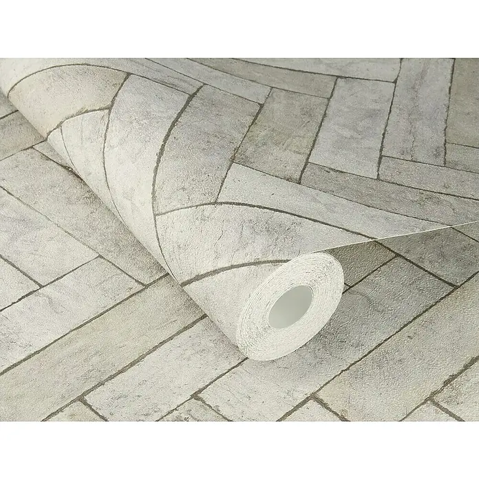 Rasch Factory V Vliestapete Bricks - Schiefergrau, Steinoptik, 10,05 x 0,53 m - Nahaufnahme einer Rolle grauer Stein-Tapete mit einem realistischen Mauerwerk-Muster für stilvolle Wandgestaltung.