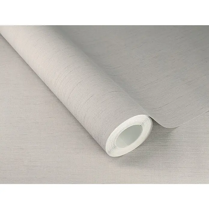 Rasch Wall Textures VI Vliestapete Struktur-Uni - Hellgrau, Uni, 10,05 x 0,53 m - Nahaufnahme einer Rolle hellgrauer Tapete mit feiner Textur, die ein elegantes und schlichtes Design für die Wandgestaltung zeigt.