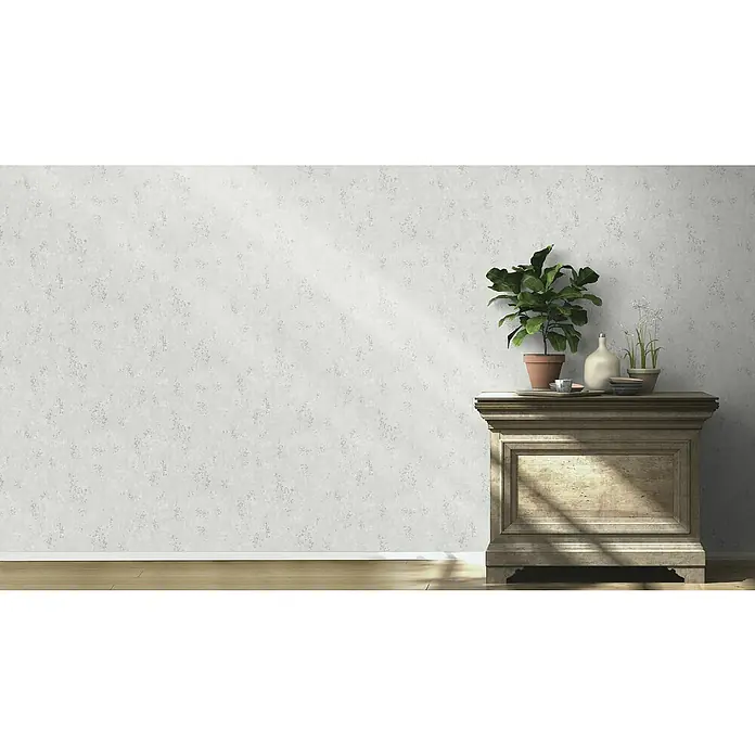 Rasch Color your life Vliestapete Struktur-Uni - Hellgrau, Steinoptik, 10,05 x 0,53 m - Elegante Kommode aus Holz mit Topfpflanzen und Dekorationsobjekten, die ein stilvolles Ambiente im Raum schafft.\n