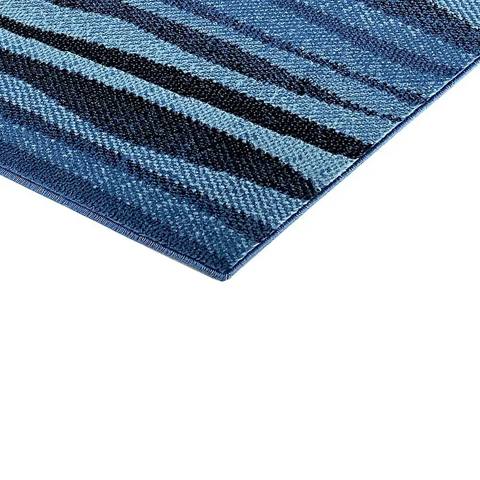 Alfombra de pelo corto Ondas - Azul, 170 x 120 cm, Polipropileno - Primer plano de una alfombra con rayas azules y negras y una superficie texturizada. Ideal para espacios modernos.
