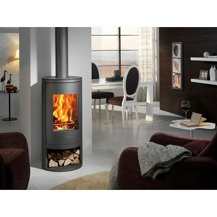 Panadero Estufa de leña Auckland - 7,4 kW, Volumen de calefacción: 220 m³, Antracita - Una estufa de leña moderna proporciona calidez y ambiente en la elegante sala de estar. La leña se almacena prácticamente en el compartimento inferior.