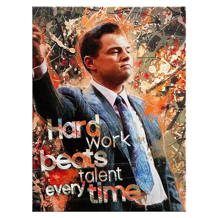 Dotcomcanvas Leinwandbild - Hard Work Beats Talent Everytime, B x H: 30 x 40 cm - Farbenfroher Kunstdruck von Leonardo DiCaprio im Anzug mit Farbspritzern und dem Zitat „Hard work beats talent every time“.