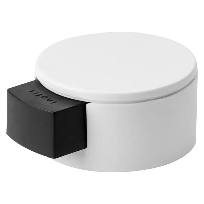 Inofix Tope de puerta 2420 - Plástico, Blanco - Primer plano de un tope de puerta redondo blanco con un protector de goma negro.