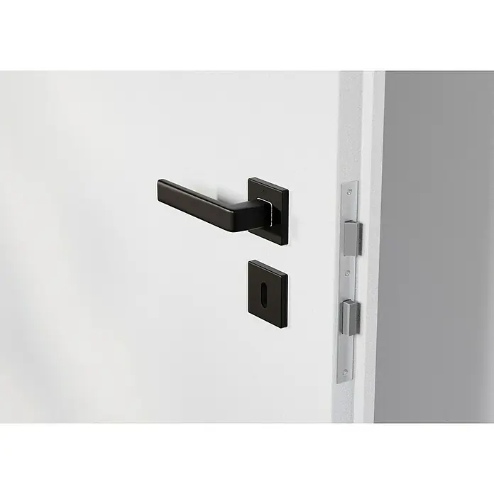 Hoppe Zimmertürgarnitur Dublin - Stärke Tür: 42 mm - 37 mm, Aluminium, Schwarz, Buntbart - Elegante schwarze Türgriffgarnitur auf einer weißen Tür, die modernes Design und Funktionalität vereint.