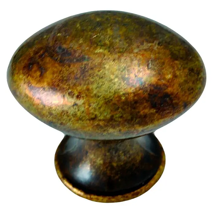 Nesu Tirador para muebles 265 - Tipo de tirador del mueble: Botón, L x An x Al: 3,7 x 2,9 x 3,4 cm, Acero - Primer plano de un tirador de mueble ovalado color bronce con un acabado rústico y una forma decorativa para cajones y armarios.
