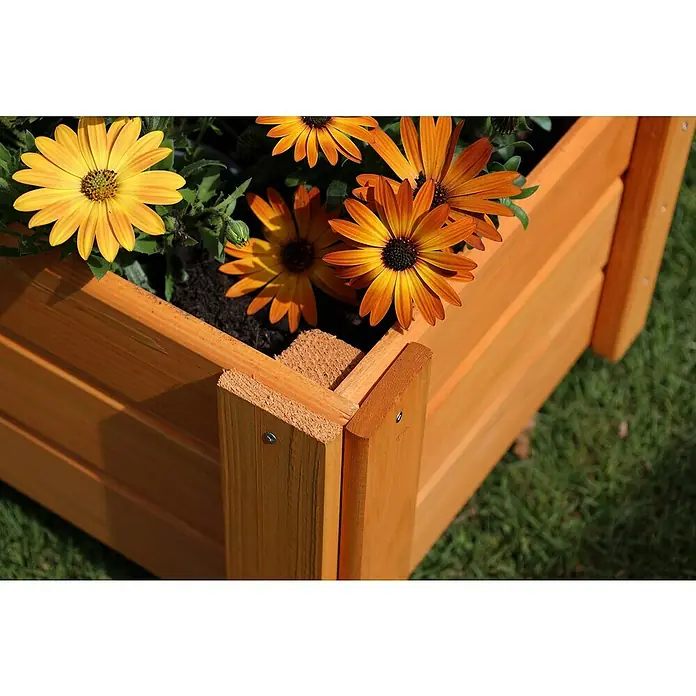 Promadino Pflanzkasten Flora - Außenmaß (L x B x H): 91 x 41 x 130 cm, Holz, Honigbraun - Ein hölzerner Pflanzkasten mit gelben und orangen Gänseblümchen, der eine natürliche und warme Atmosphäre schafft.