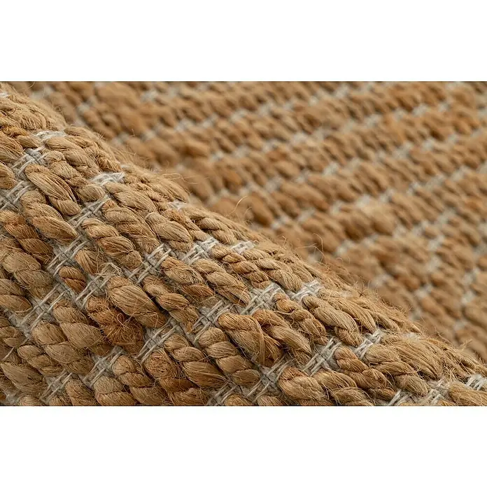 Juteteppich Nature 501 - Naturbraun, 230 x 160 cm, 100 % Jute - Detailaufnahme eines beigen, handgewebten Teppichs aus Naturfasern mit hellen Akzenten. Textur und Verarbeitung sind gut erkennbar.