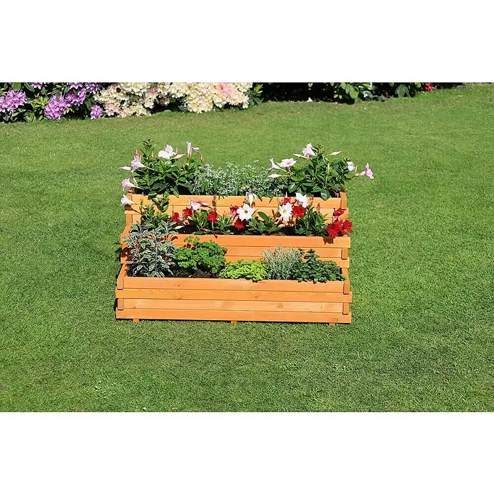 Promadino Pflanzkasten Volterra - Braun, Holz - Ein dreistöckiger Pflanzkasten aus Holz mit verschiedenen Pflanzen und Blumen, der im Garten steht.