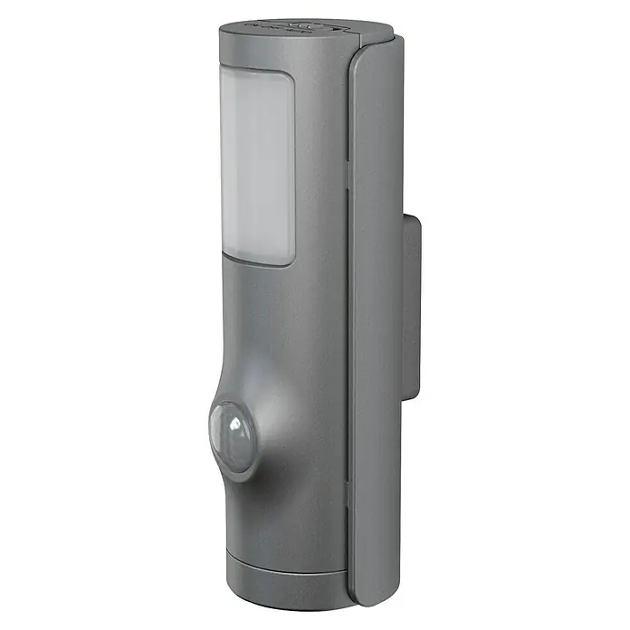 Osram Nightlux Mobiles LED-Licht Torch - Schwarz, 36 x 42 x 108 mm - Nahaufnahme einer grauen Außenleuchte mit Bewegungsmelder und Lichtfenster.