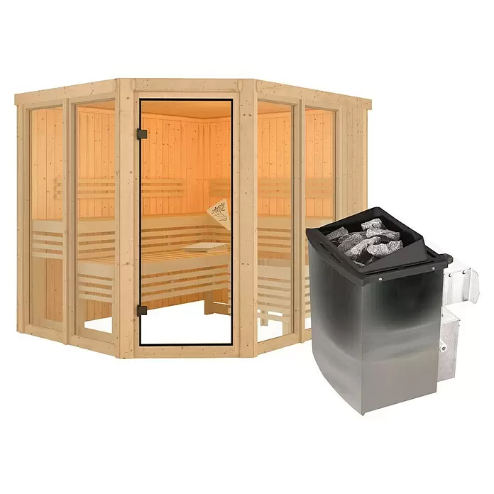Karibu Elementsauna Katima - 9 kW Saunaofen mit integrierter Steuerung, L x B x H: 196 x 231 x 198 cm - Helle Holzsaunakabine mit Glaswänden und Tür, daneben ein dunkler Metallsaunaofen mit Steinen.