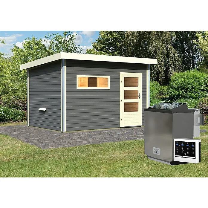 Karibu Saunahaus Danga - 9 kW Bio-Saunaofen mit externer Steuerung, Terragrau, L x B x H: 231 x 396 x 227 cm - Außenansicht einer modernen Gartensauna mit einem grauen Holzhaus und einem silberfarbenen Saunaofen mit Steinen.