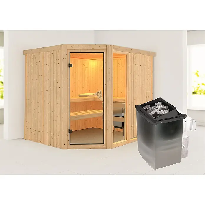 Karibu Elementsauna Mulilo - 9 kW Saunaofen mit integrierter Steuerung, L x B x H: 196 x 231 x 198 cm - Diese Aufnahme zeigt eine Ecksauna aus hellem Holz mit Glastür und einen Saunaofen mit Steinen. Perfekt für Wellness zu Hause.