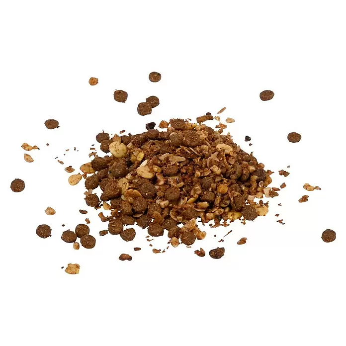 Dobar Igelfutter -  - Ein Haufen braunes körniges Vogelfutter mit helleren Flocken und verstreuten Pellets.