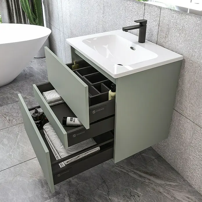 Disbain Conjunto de mueble de baño Kuntur - Ancho: 60 cm, Verde té, Mate - Mueble de baño moderno verde con cajones abiertos y grifo elegante, perfecto para un baño. Almacenamiento y diseño combinados.